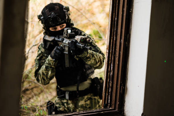 Soldier in Cropat uniform with black belt and plate carrier