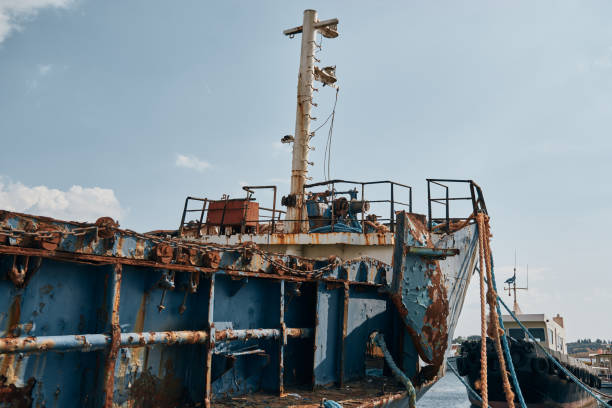 istock Large Blue Rusty Cargo Boat With Peeling Blue Paint Abandoned In Greek Port 1273856641