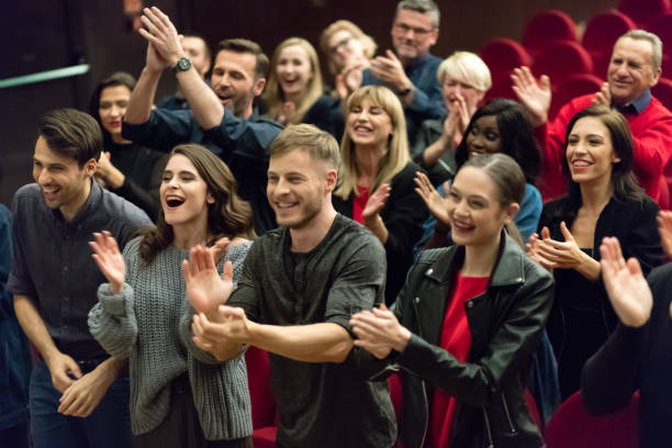 istock Happy audience applauding in the theater 1273858132