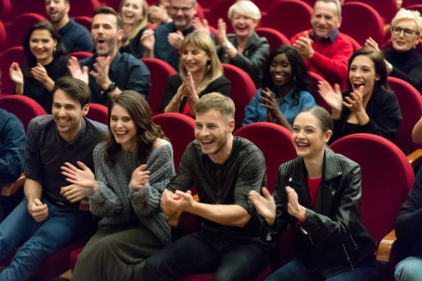istock Happy audience applauding in the theater 1273858314