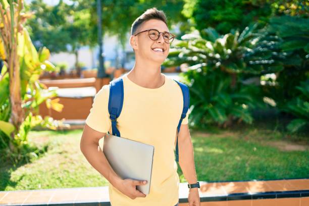 istock Young hispanic student smiling happy walking the university campus 1273858331