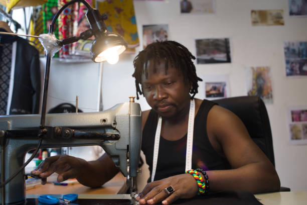 istock a couturier sewing with his sewing machine in his workshop 1273858589
