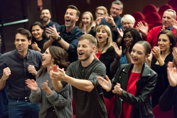 istock Happy audience applauding in the theater 1273858608