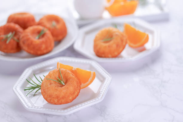 istock Orange bundt cake on a marble board 1273860665