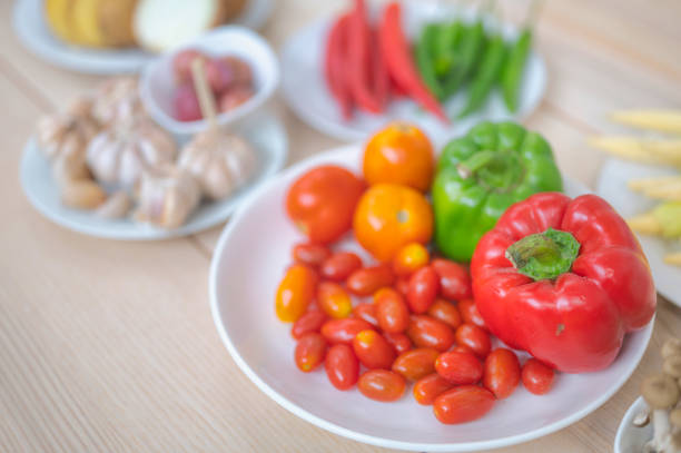 istock Fresh vegetable and fruit on wooden table in kitchen 1273860992