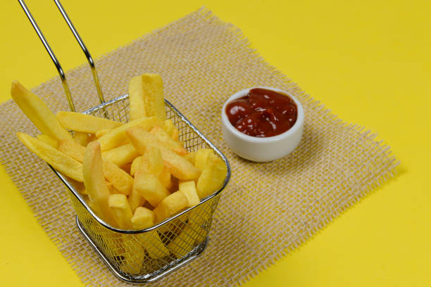 istock portion of potato chips in a metal basket. 1273861210