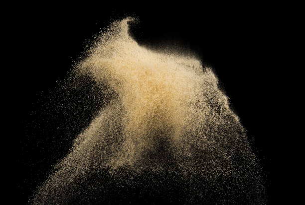 istock Sand splash explosion isolated on black background ,throwing freeze stop motion object design 1273861287