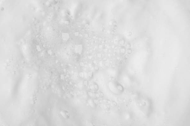 istock Bubble foam from soap or shampoo on top view texture background 1273862136
