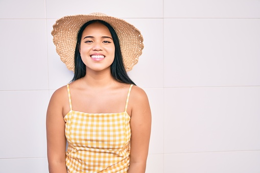 Young asian girl smiling happy at the city