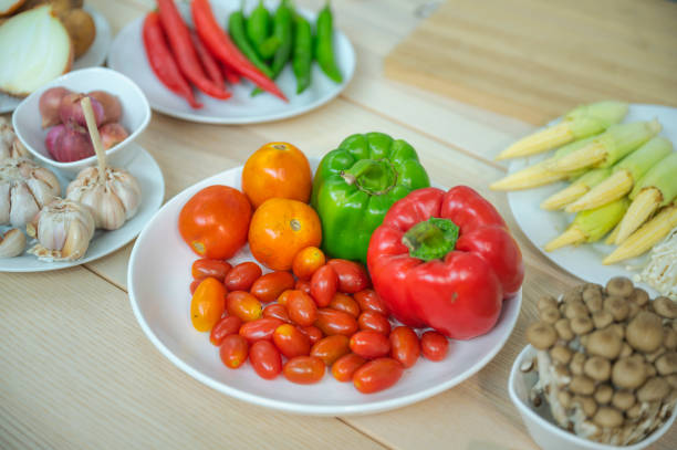 istock Fresh vegetable and fruit on wooden table in kitchen 1273862720