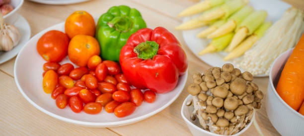 istock Fresh vegetable and fruit on wooden table in kitchen 1273862955
