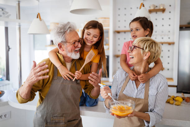 istock Grandchildren having fun at home while playing with their grandparents 1273863240