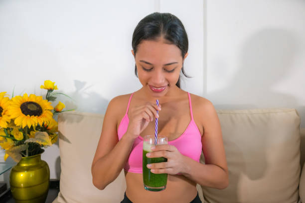 istock Girl with green shake 1273863667