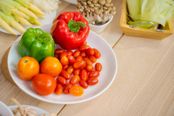 istock Fresh vegetable and fruit on wooden table in kitchen 1273863876
