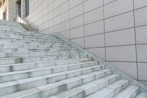 An empty modern and clean staircase at the entrance of a subways station in Copenhagen, Denmark.