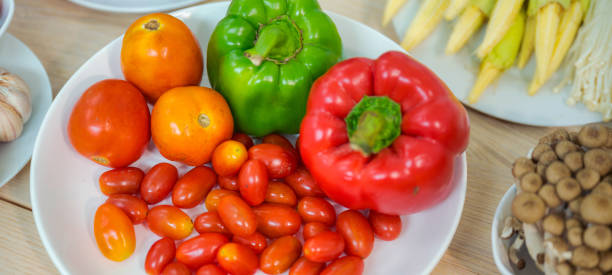 istock Fresh vegetable and fruit on wooden table in kitchen 1273864133