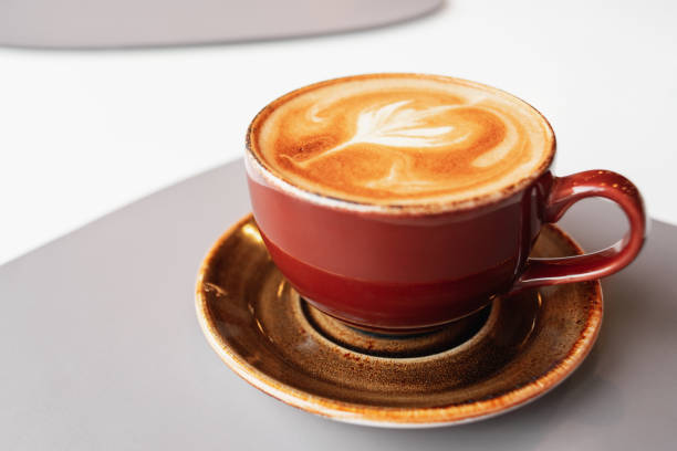 istock Morning coffee in a ceramic cup with foam on a saucer. 1273866282