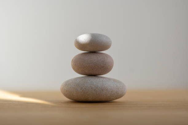 istock One simplicity stones cairn isolated on white background, group of light white pebbles in tower 1273866310