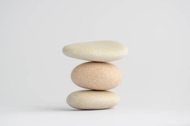istock One simplicity stones cairn isolated on white background, group of light white pebbles in tower 1273866330