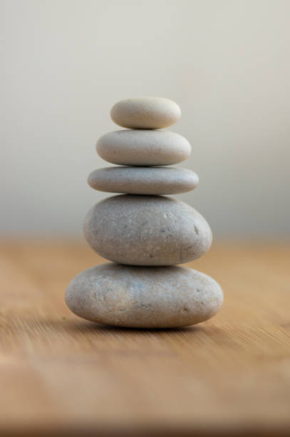 istock One simplicity stones cairn isolated on white background, group of light white pebbles in tower 1273866354