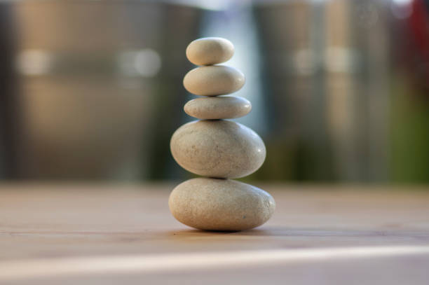istock One simplicity stones cairn isolated on white background, group of light white pebbles in tower 1273866361
