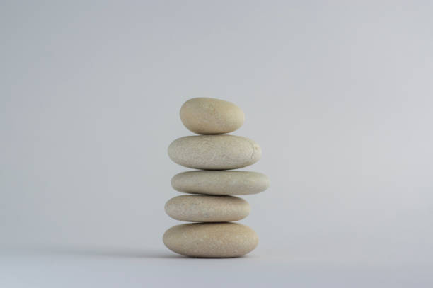 istock One simplicity stones cairn isolated on white background, group of light white pebbles in tower 1273866383