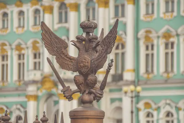 Photo of three-headed eagle with sword and sceptre of power symbol of tsarist Russia