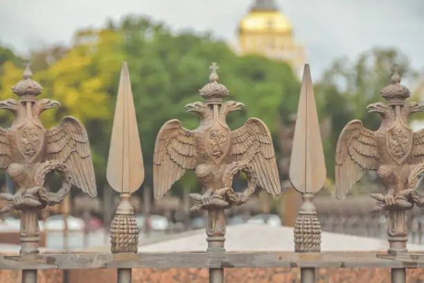 Photo of three-headed eagle with sword and sceptre of power symbol of tsarist Russia