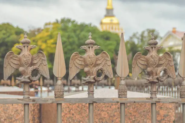 Photo of three-headed eagle with sword and sceptre of power symbol of tsarist Russia