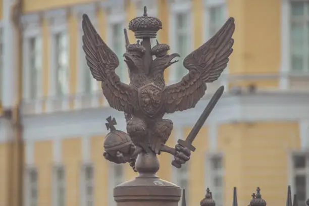 Photo of three-headed eagle with sword and sceptre of power symbol of tsarist Russia