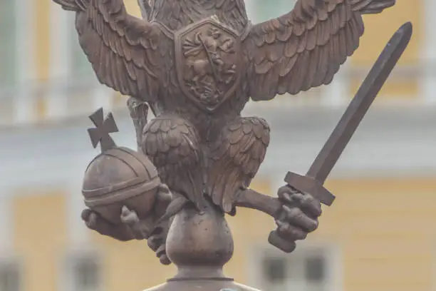Photo of three-headed eagle with sword and sceptre of power symbol of tsarist Russia