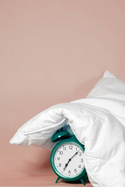 istock Alarm clock under the pillow - Don't want to wake up concept 1273867857