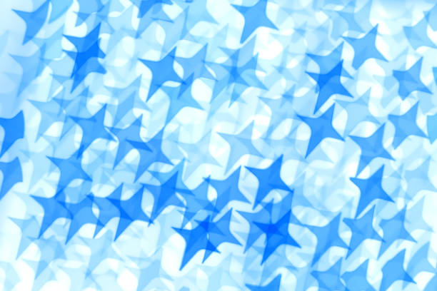 Blue background made of defocused bokeh with star shape (inversion). It's a REAL bokeh photo, not an illustration or computer filter.
