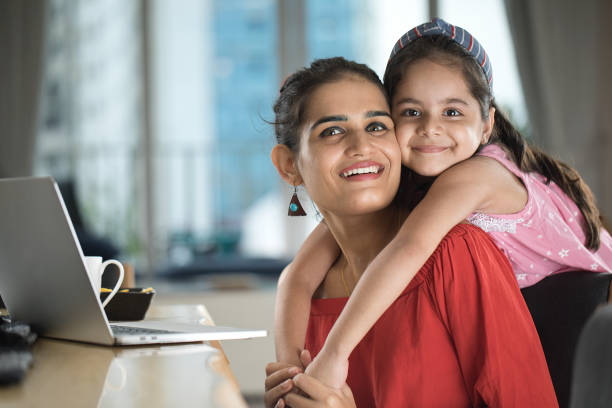 istock Loving daughter embracing mother at home 1273869745