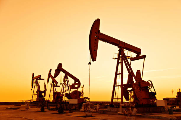 istock Oil pumps and rig at sunset 1273871943