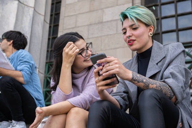 istock Punk student bonding with her friend on campus 1273875898