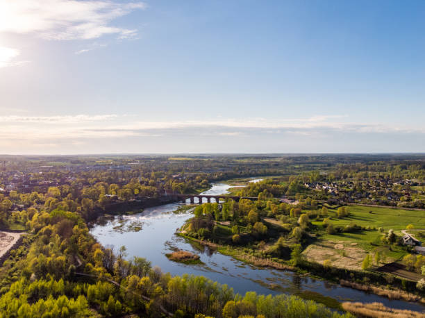 istock Areal countryside view from drone with small river Venta. 1273876036