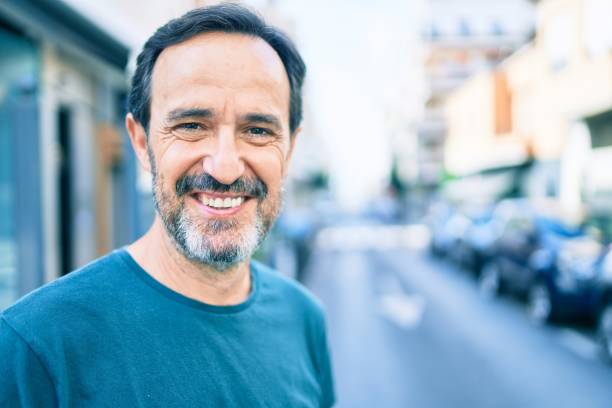 istock Middle age man with beard smiling happy outdoors 1273876212
