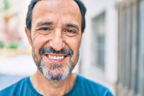 istock Middle age man with beard smiling happy outdoors 1273876227
