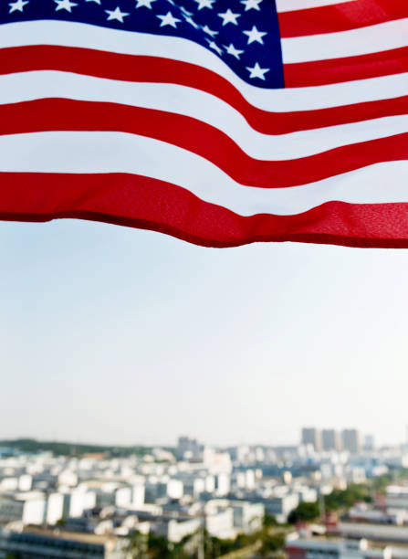 istock Waving American flag and building 1273876786