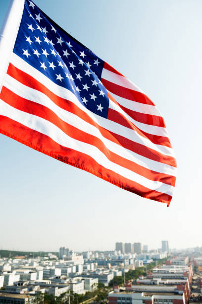 istock Waving American flag and building 1273876855