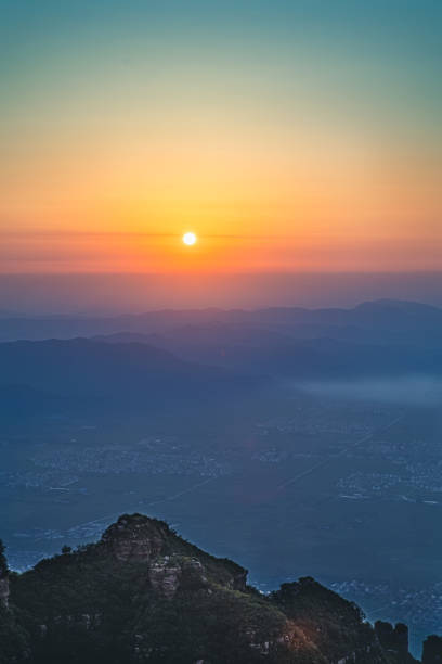 istock Mountains And City At Sunrise 1273876996