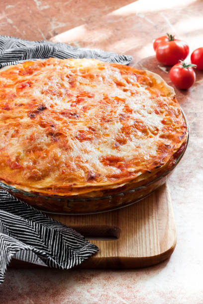 istock Homemade lasagna in round glass baking dish 1273878712