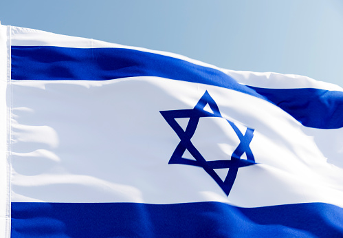 Close-up of  Israel's national flag in the wind.