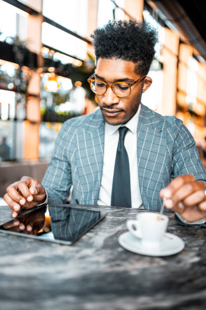 istock Stylish businessman at the bar having a coffee 1273879306