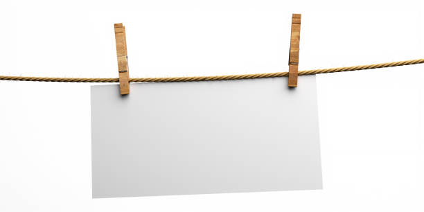 istock Blank note spread on rope with wooden clothespins isolated cutout on white background. 3d illustration 1273880173