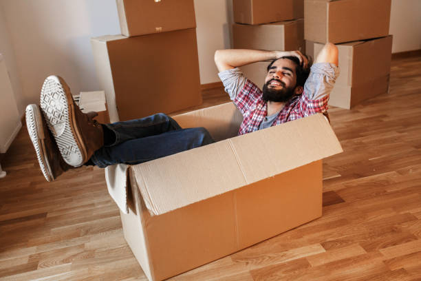 istock Young man moving into a new home. 1273880923