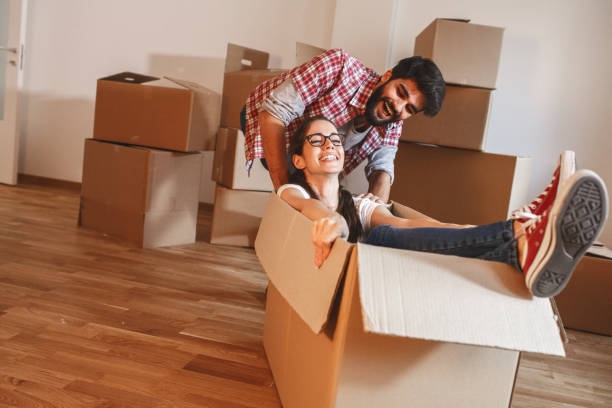 istock Young couple moving into a new home. 1273880933