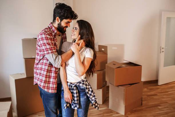 Young couple moving into a new home.
