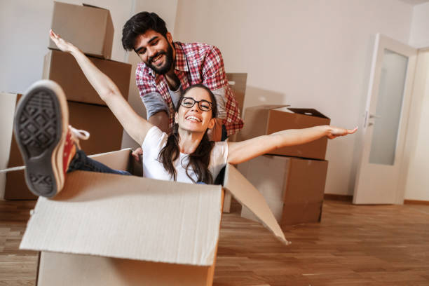 istock Young couple moving into a new home 1273881125